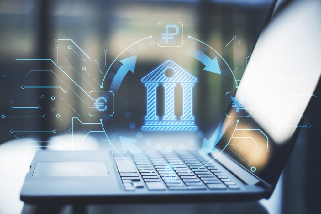開業資金の調達に活用できるオンライン融資やフィンテックサービスを象徴する銀行と通貨のデジタルアイコン