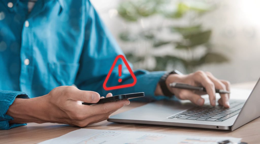 インターネットで売掛金買取業者を探す際に注意すべきリスクやトラブルを警告する赤いビックリマーク