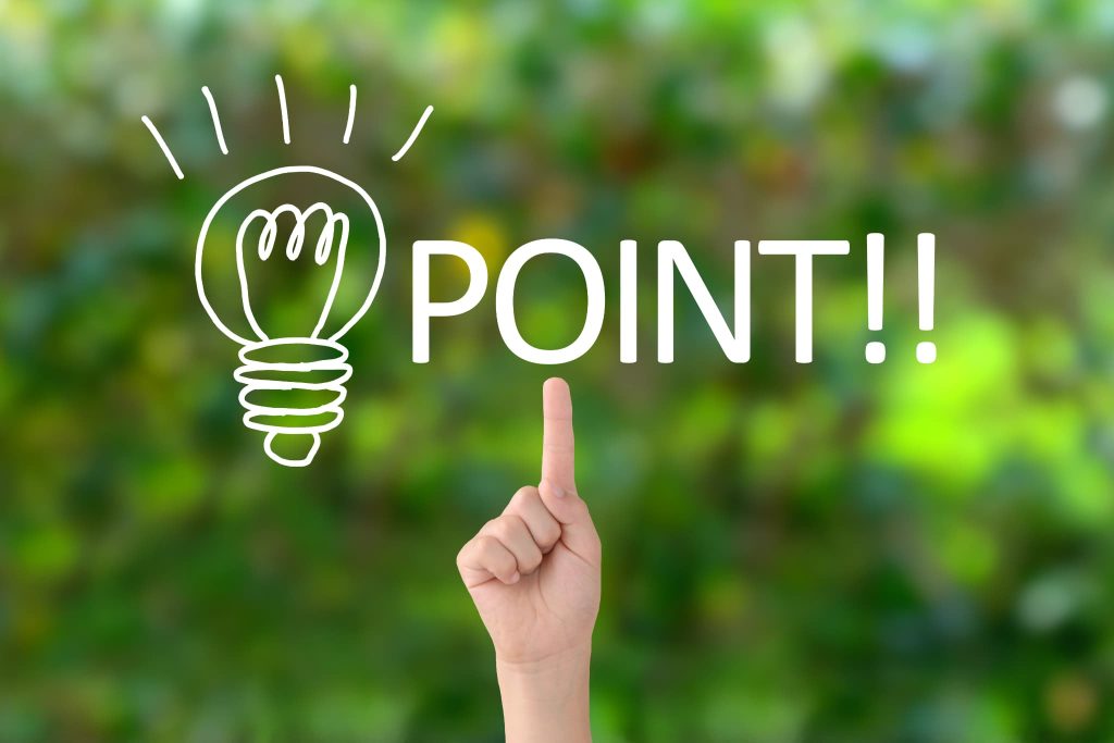 緑の背景に浮かぶ電球のイラストと「POINT!!」の文字を指差す手。法人ビジネスローン選びで失敗しないための重要な比較ポイントを強調